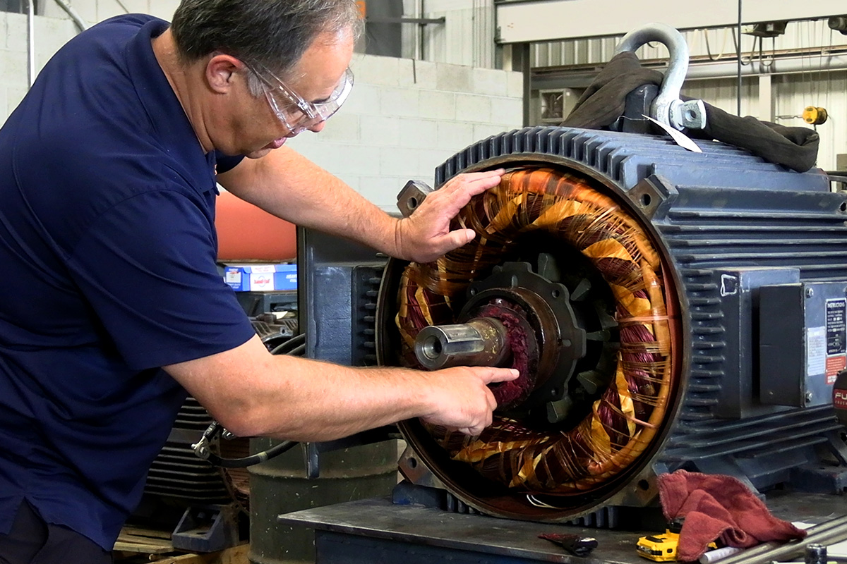 H&N Electric technician performing industrial electrical inspection and electric motor maintenance