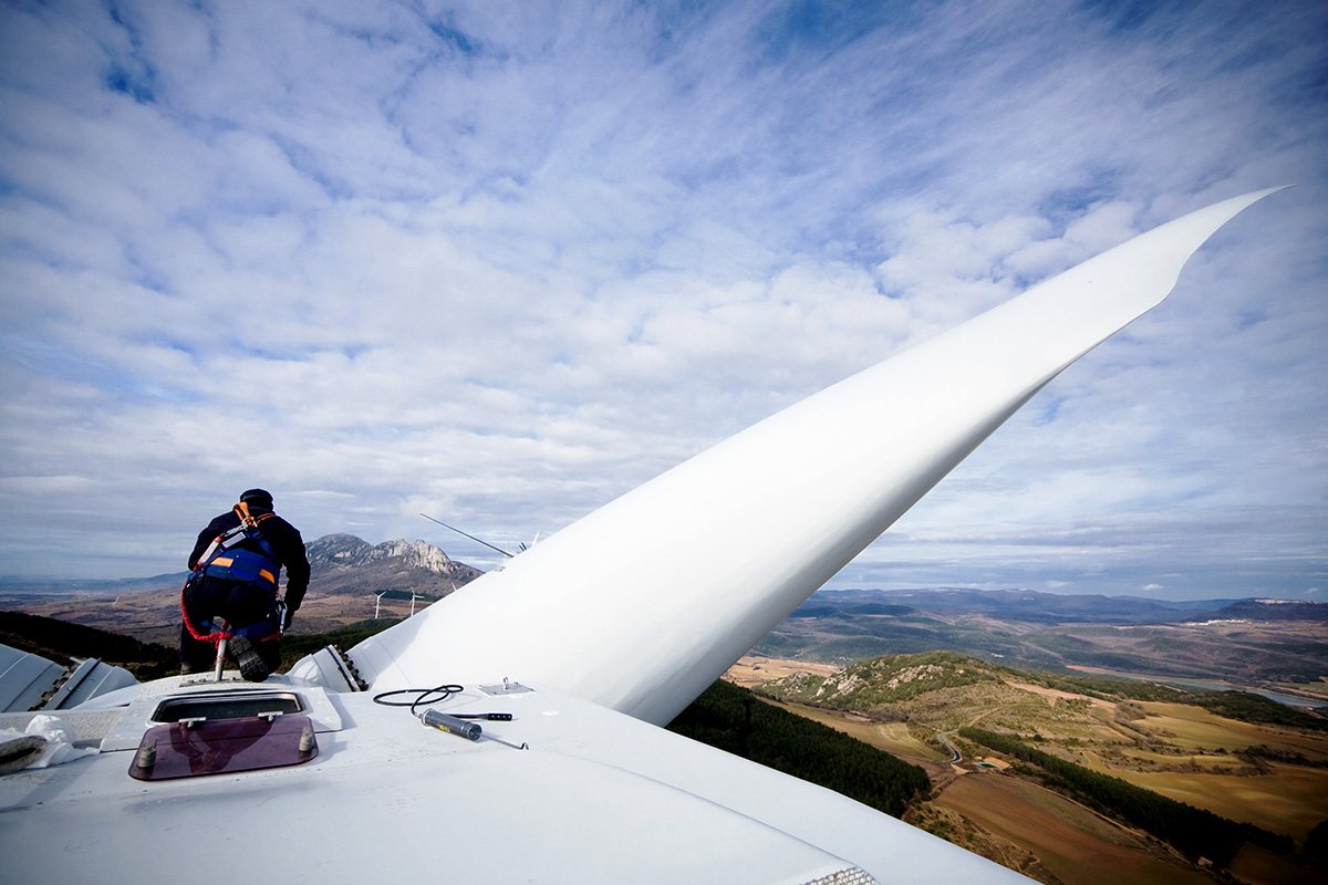 A H&N Electric technician begins to repair on top of a wind turbine as part of their electric motor repair and field maintenance solutions